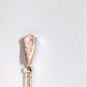 Gold, necklace with gemstone in the middle.  10 in.